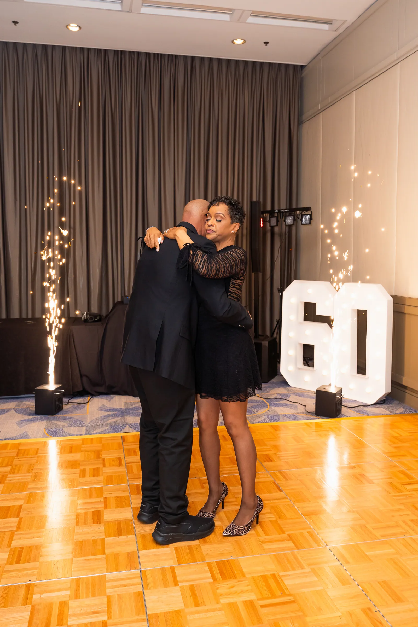 Couple dancing at a milestone birthday celebration
