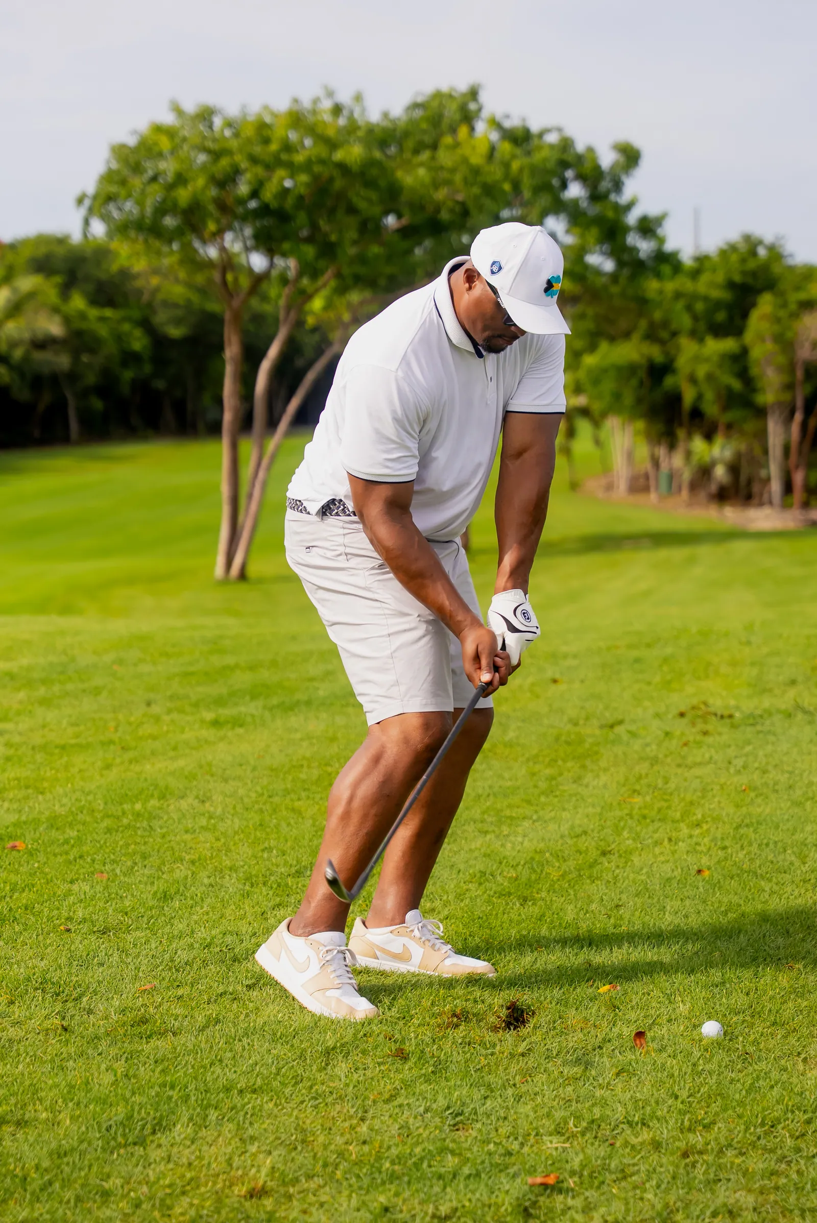 Tournament player mid-swing at the Eddie George Celebrity Golf Classic