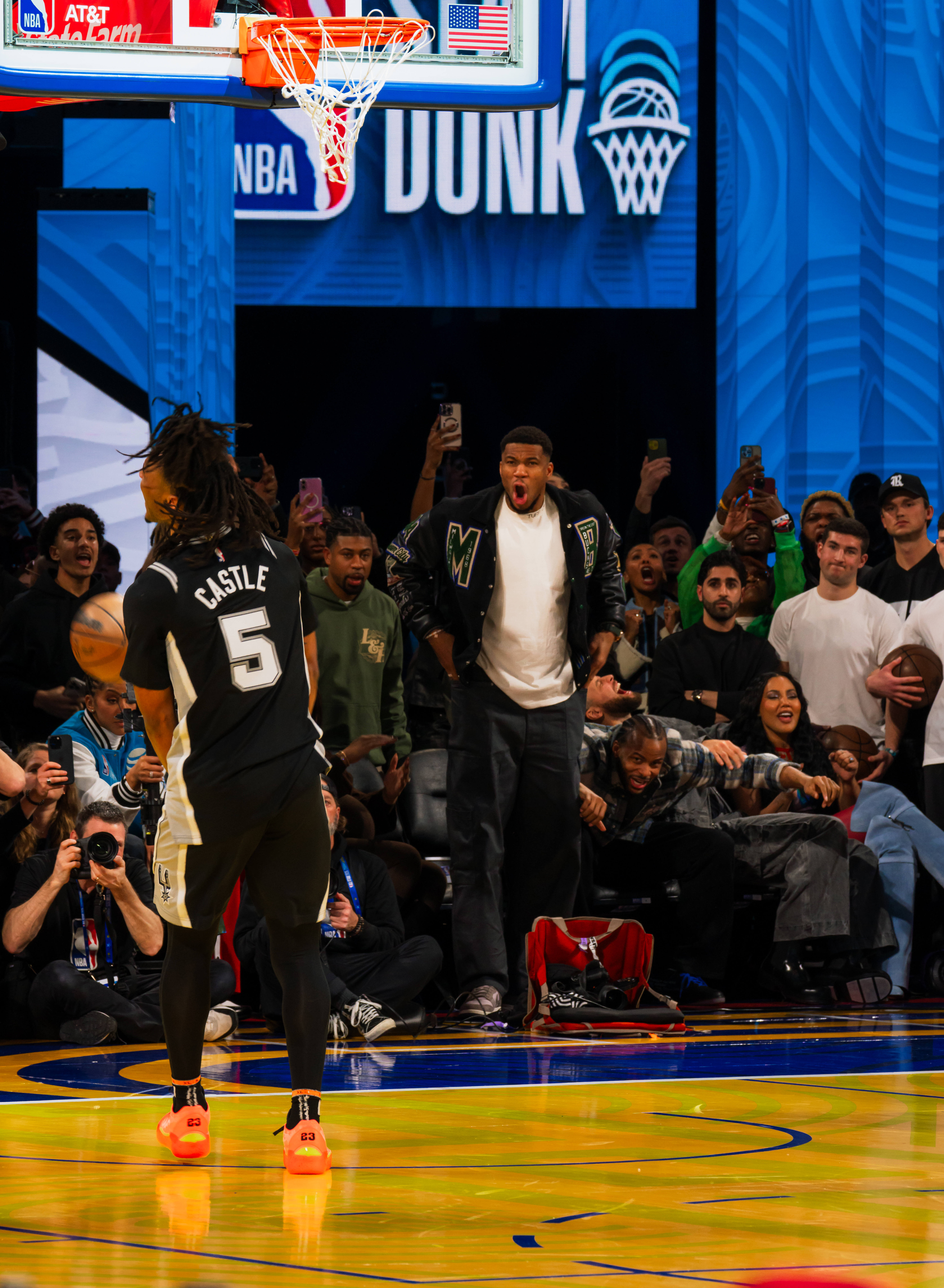 Stephon Castle #5 of the San Antonio Spurs after a dunk, crowd erupting at the 2025 Slam Dunk Contest